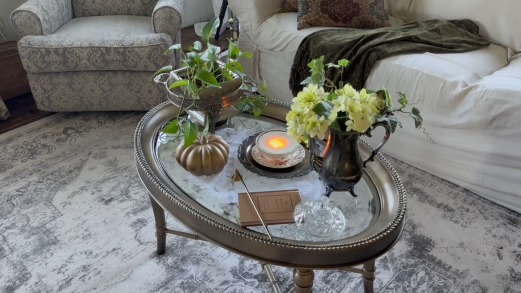 Fall decorating ideas for a cozy historic home featuring a coffee table styled with vintage fall decor and warm autumn accents.