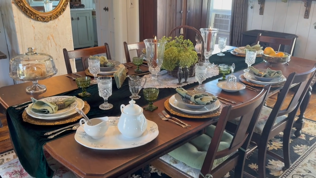Fall decorating ideas for a cozy historic home dining room featuring a vintage tablescape with thrifted dishes and elegant autumn accents.